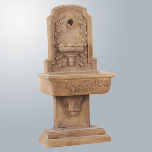 Image of a wall mounted fountain with a lemon design.