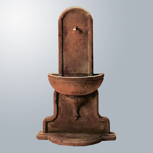 Outdoor wall fountain designed for a spout