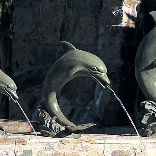 Brass dolphin garden accent for pool area