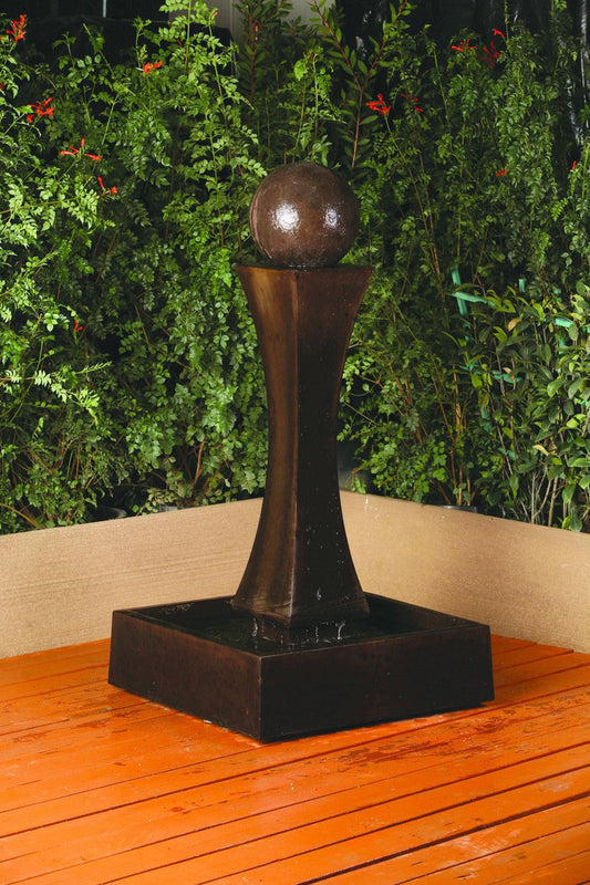 Small indoor water feature with a sphere accent