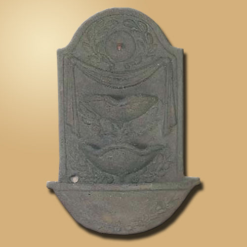 Image of a decorative outdoor water feature designed to be mounted on a wall