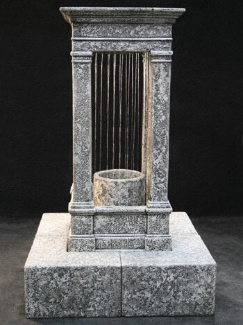 Tall outdoor water feature with column and rain effect