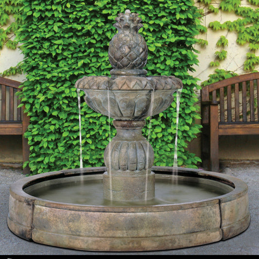 Outdoor fountain with pineapple design in a pool