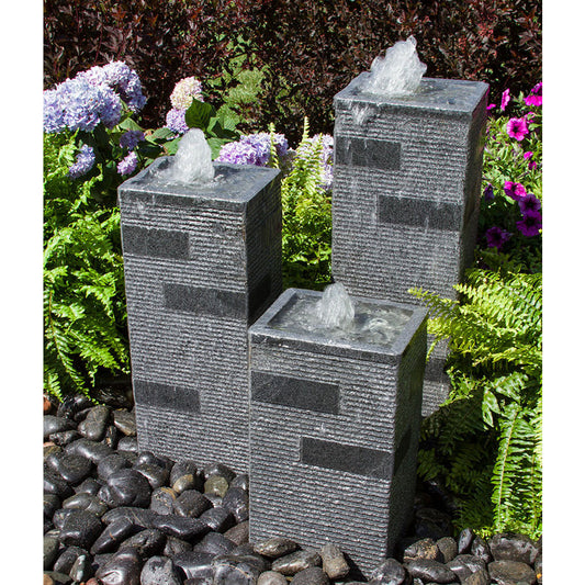Outdoor fountain with polished block stone towers