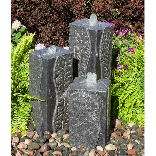 Image of a polished corner triple granite stone fountain.