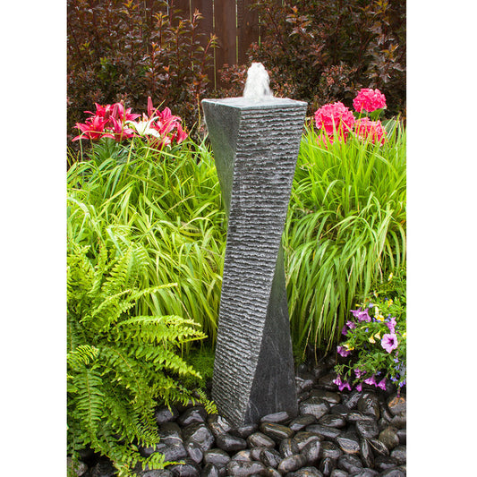 Image of a polished granite stone fountain with a twisted design