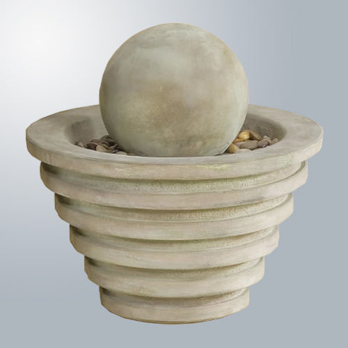 Image of a decorative water feature with a ring and ball design