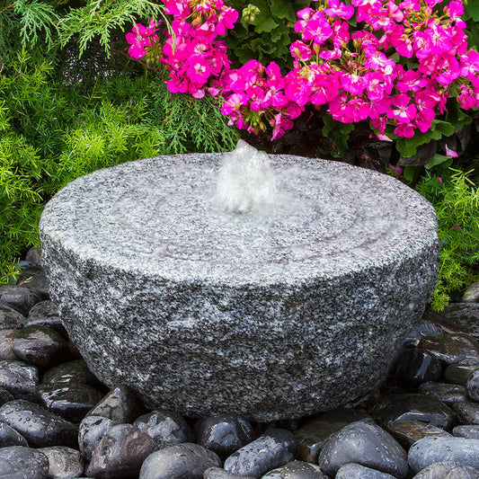 Granite stone fountain with ringed circle design