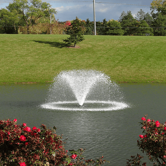 SCOTT AERATOR North Star Fountain Aerator - On Water Diisplay with Green Grass and Trees at the Background