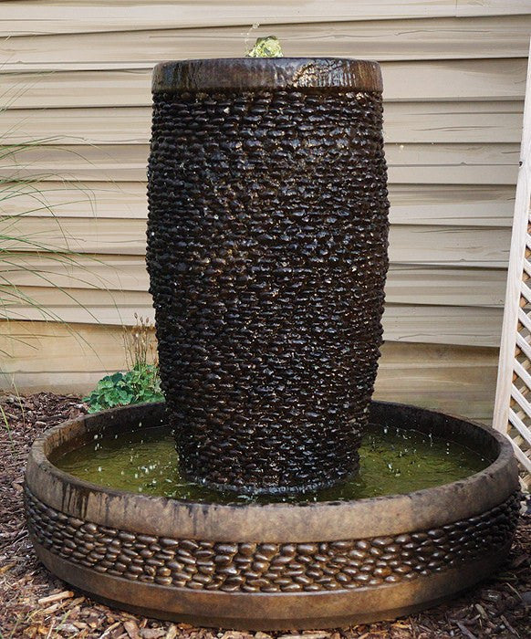 Image of a decorative water feature with reflective stones