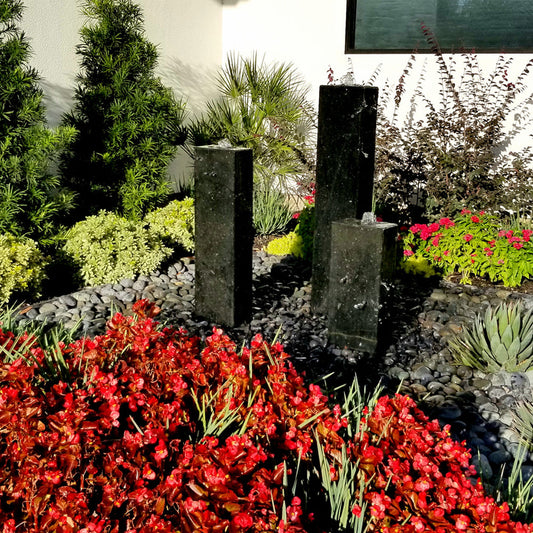 Image of a smooth black granite triple stone fountain.