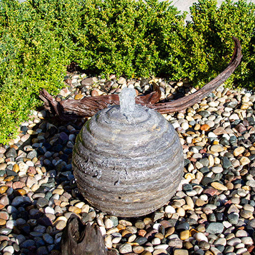 Ribbed limestone sphere stone fountain