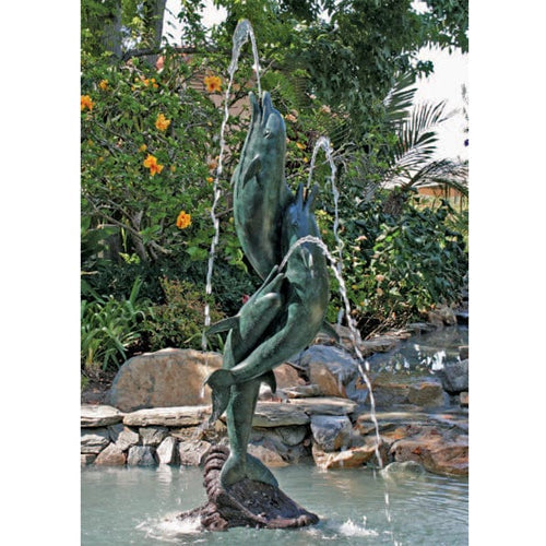 Image of a tall entwined dolphins garden or pool accent made of brass.