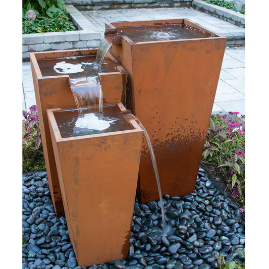Outdoor fountain with three tiers made of rusted corten steel