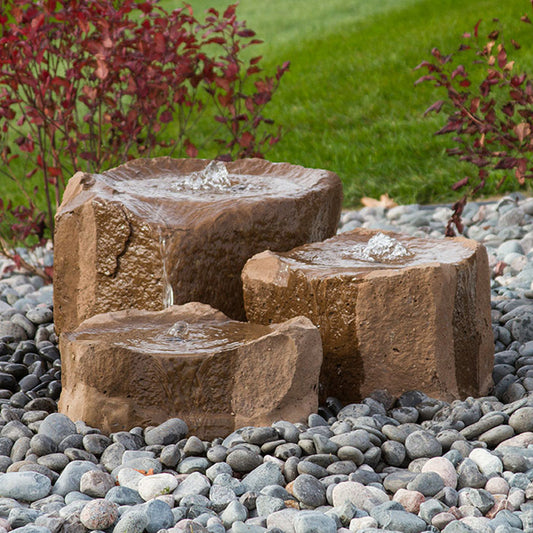 Garden stone fountain with three tiers