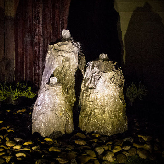 Outdoor fountain with three rock tiers