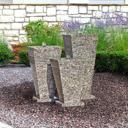 Outdoor fountain with three stone urns
