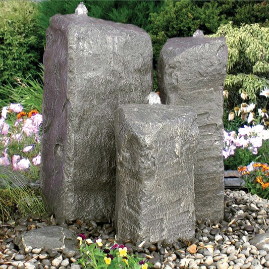 Outdoor fountain with three stone tiers and cascading water