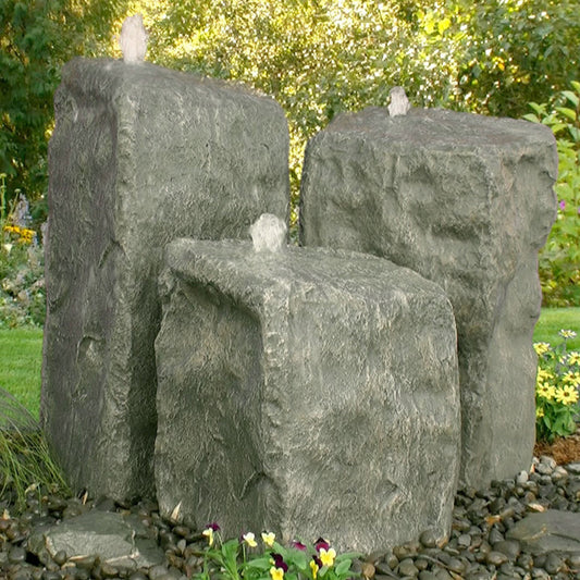 Outdoor fountain with three rock tiers