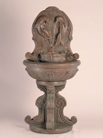 Outdoor wall fountain featuring a dolphin design