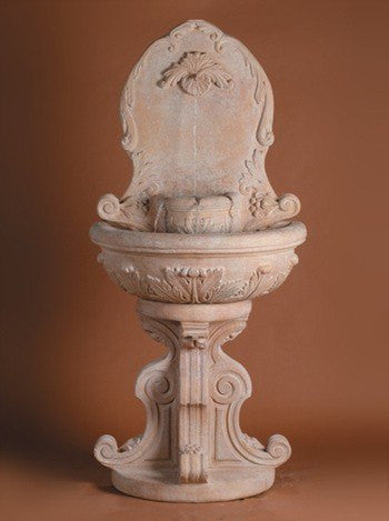 Cast stone outdoor wall fountain with garland design
