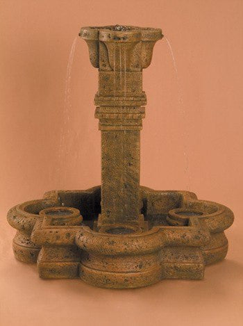 Small garden fountain with plinth column and quatrefoil basin