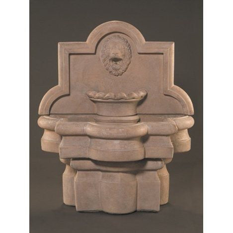 Outdoor wall fountain with lion and quatrefoil design