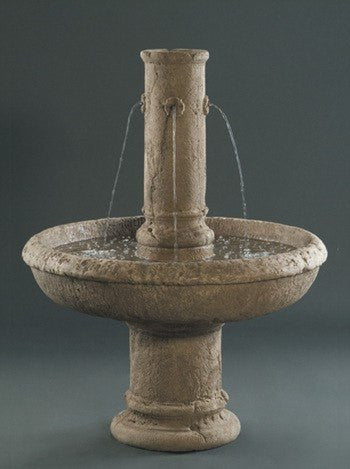 Cast stone outdoor fountain featuring a figure of St. Michael.