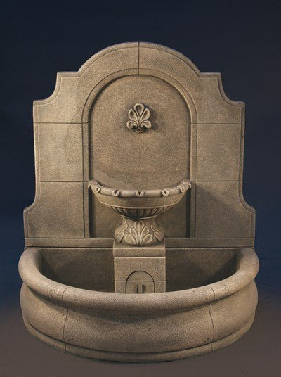 Outdoor wall fountain made of cast stone with a plain basin