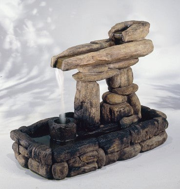 Inuksuk inspired outdoor water feature with flowing water