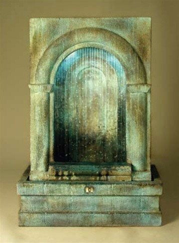 image of a decorative water feature with a grotto design and cascading water